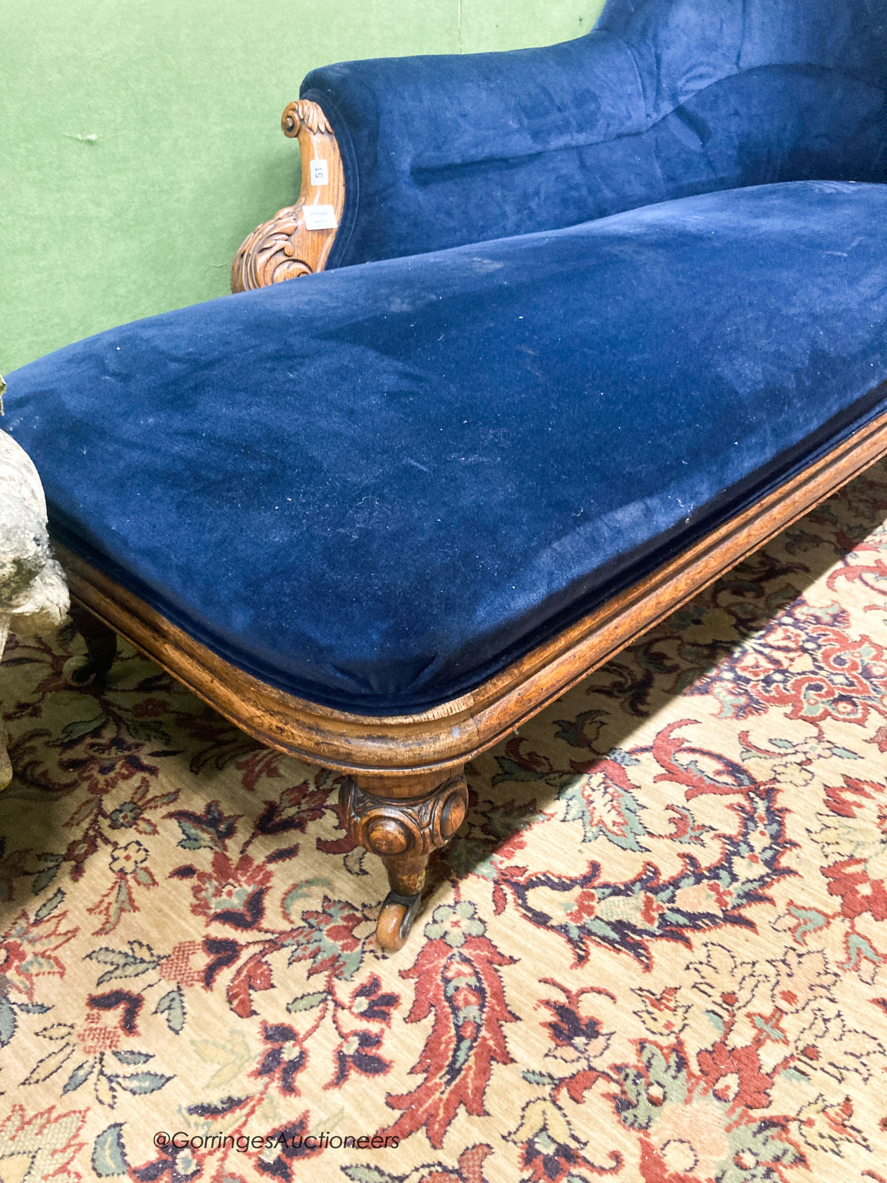 A Victorian carved oak chaise longue, W.180cm D.82cm H.84cm